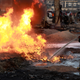 A firefighter battles to put out a ruptured pipeline fire burning at Abule-Ado in Lagos, Nigeria, Mar. 15, 2020.